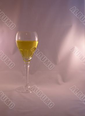 Crystal wine goblet with white wine