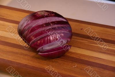Sliced red onion opening up