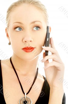 portrait of elegant blond using cellular phone