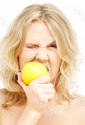 lovely blond biting lemon