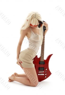 girl in mask with red guitar