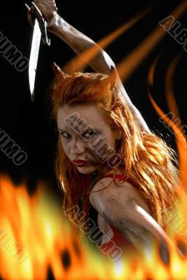 red devil girl with a knife in fire