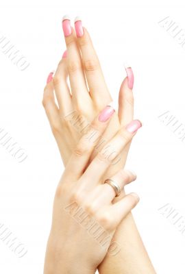 two hands with pink acrylic nails