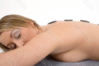 Woman sleeping having stone therapy