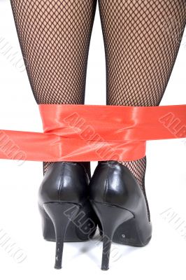 Ankles in red tape