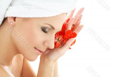 happy woman with red flower petals