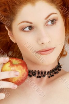 lovely redhead with delicious apple