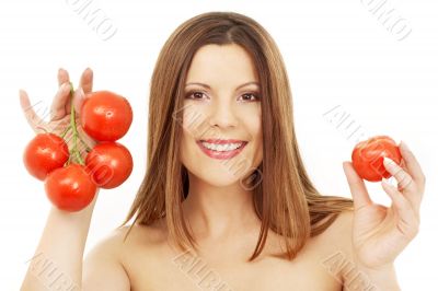 beautiful brunette girl holding tomatos