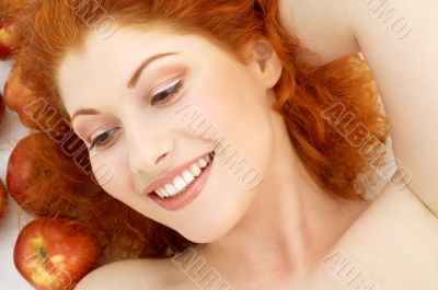 lovely redhead with red apples