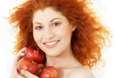 happy redhead with red apples