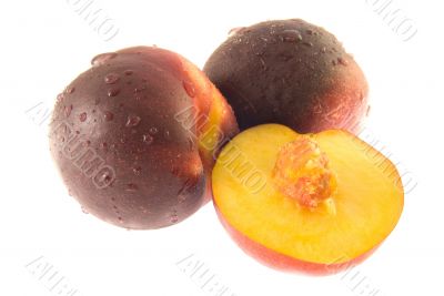 Two half ripe peaches (isolated)
