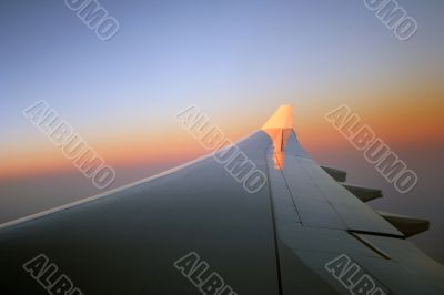 Sunrise over the aeroplane wing