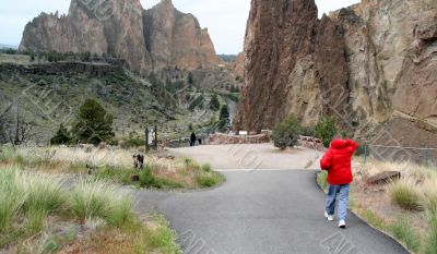 Woman in red parka, hiking