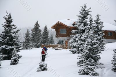 Snowshoe hikers approach the hut