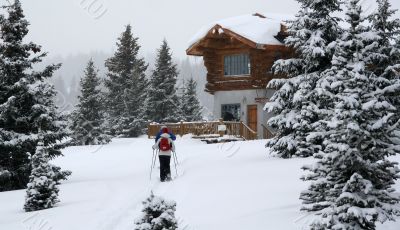 Snowshoe hikers approach the hut