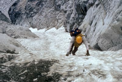 Climber on steep ice couloir