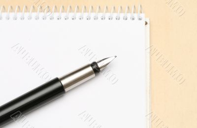 Business concepts - notebook and pen