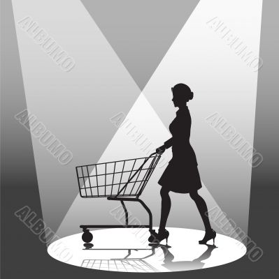Woman Shopper & Shopping Cart in Spotlight Woman Shopper & Shopping Cart in Spotlight