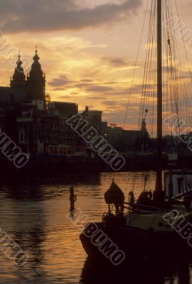 Sunset, sail boat on canal