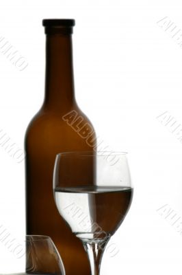 brown bottle and glasses