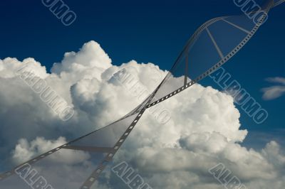 Film on a background of the cloudy sky