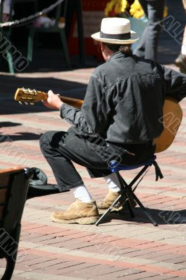Street musician, guitar