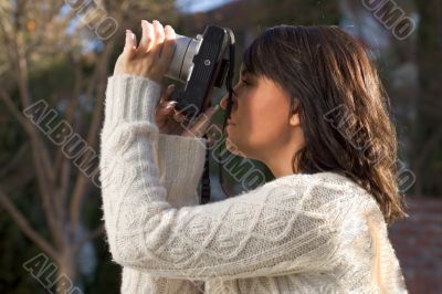 Girl with SLR photo camera