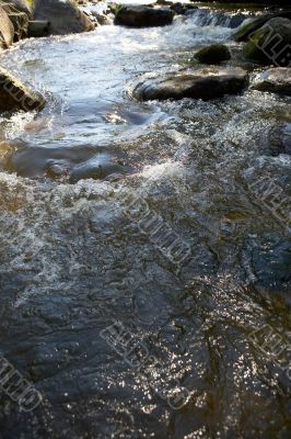 little waters with many stones and rocks