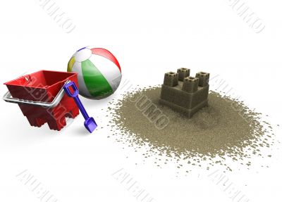 Sandcastle with beach ball, bucket and spade