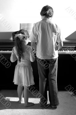 Sisters playing piano