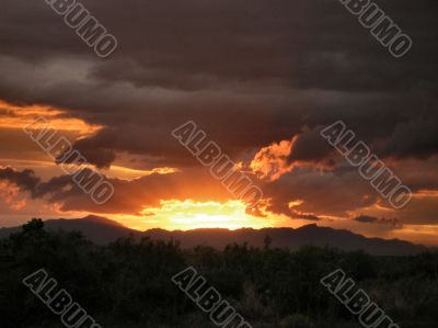  Sunset glowing up thru Rainclouds