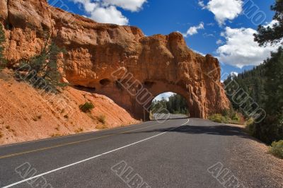 The road crosses a slope of mountain.