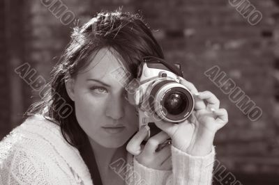 Girl with SLR photo camera