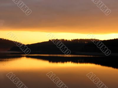 Orange sunset mirrorred in water