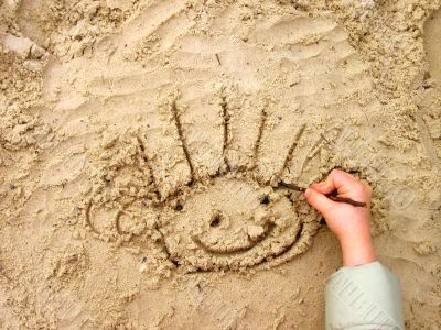 Funny smiley on wet sand