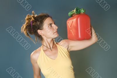 woman looks at petrol can