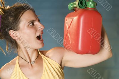 woman looks at petrol can