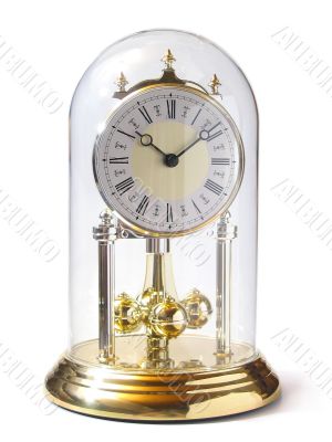 Old-fashioned gold clock isolated on white
