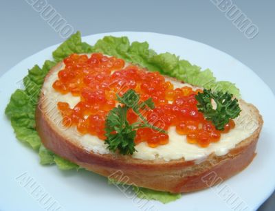 Sandwich with salmon caviar