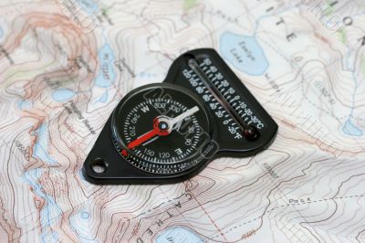Compass over hiking map