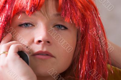 attractive woman in wig with mobile phone