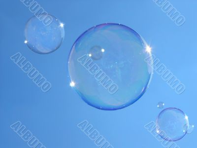 Real soap-bubbles on the blue sky