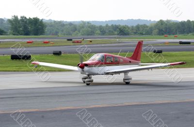 Red and White Plane on Runway