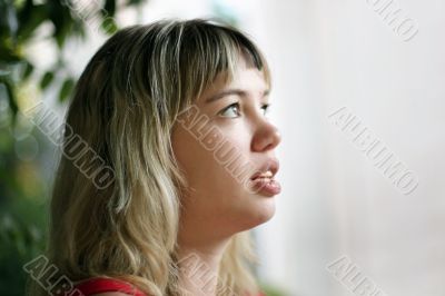 Blond girl looking up