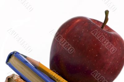 Education Series (Apple on books macro angled)
