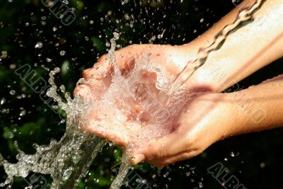 hands receiving the water