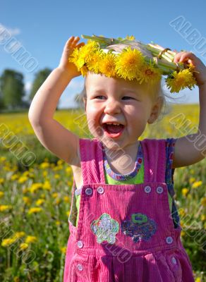 happy girl with dandelion wreath