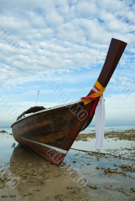 longtail boat in low tide, thailand