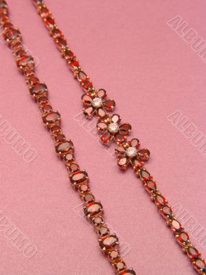 Two jewelry bracelets with garnets