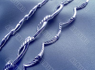 Bracelets on grey silk